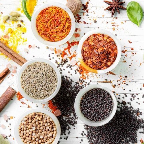 Variety of spices and seasonings on kitchen table